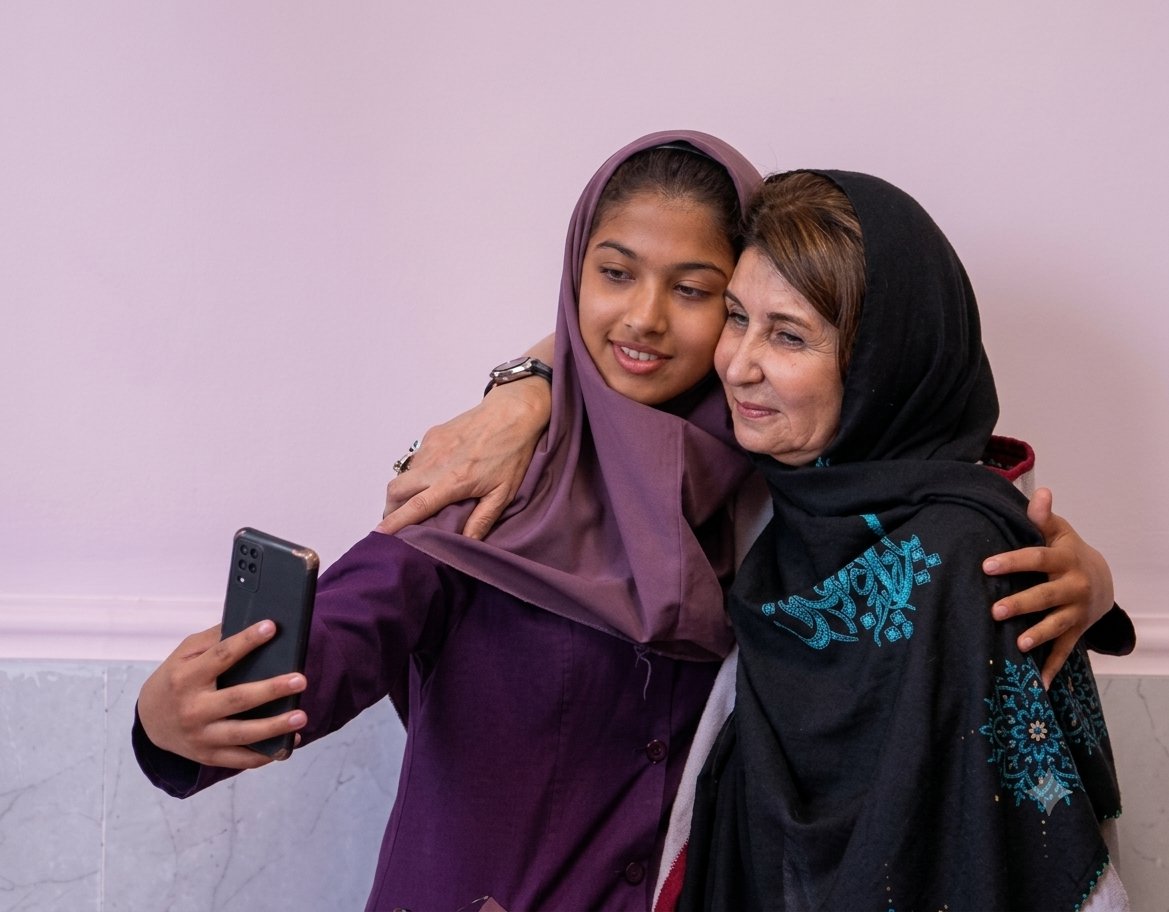 Delfarib Fanaie with a young girl